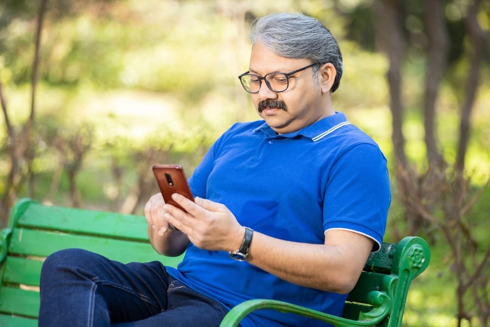 Senior citizens sitting on a bench at park