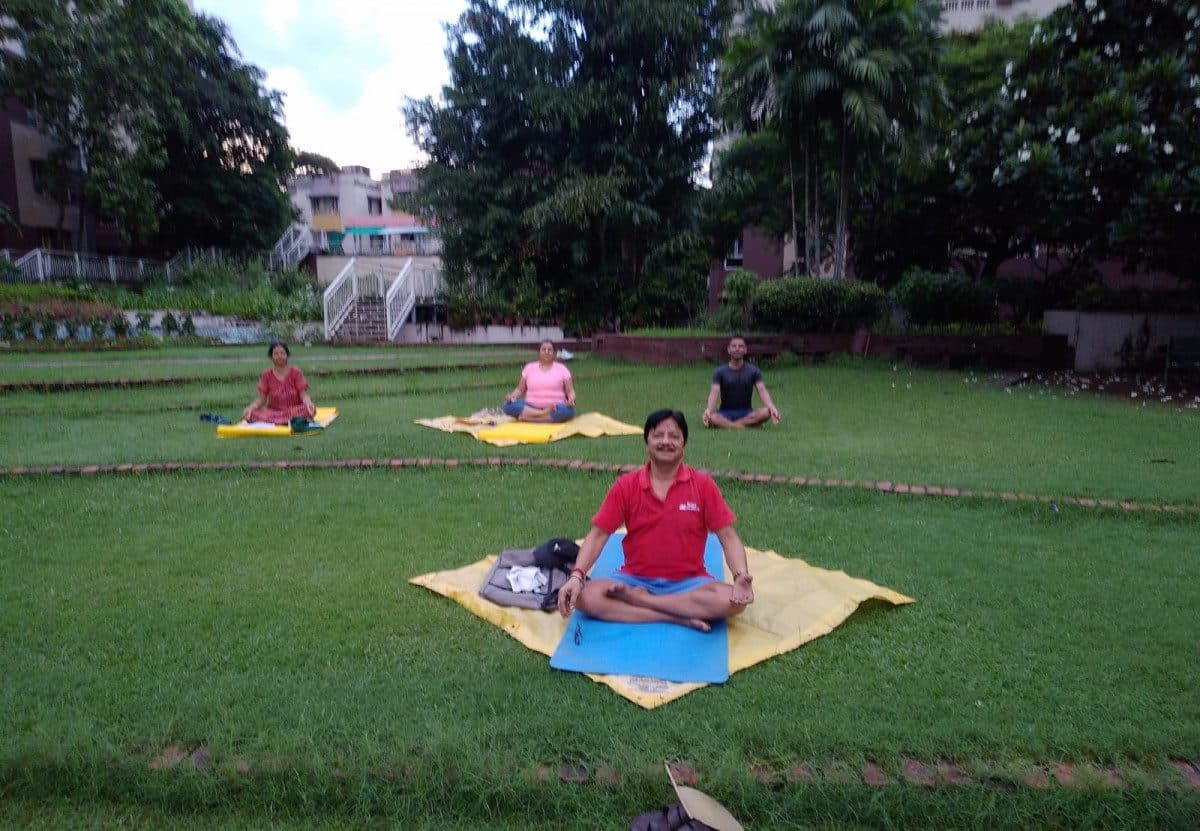 Mishra doing yoga in a park